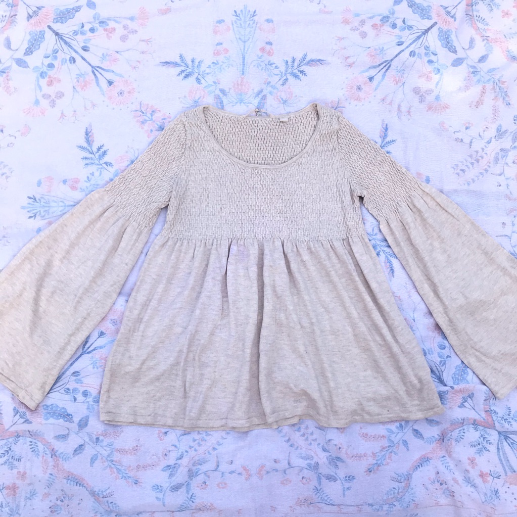 Knitted And Knotted Long Sleeve Cream Peplum Top